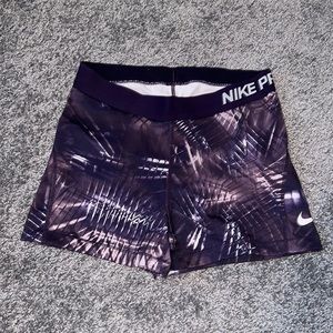 Purple Nike Pro Dri-Fit spandex shorts